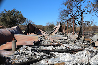 Picture of the burned down pole barn at the back of Western Town