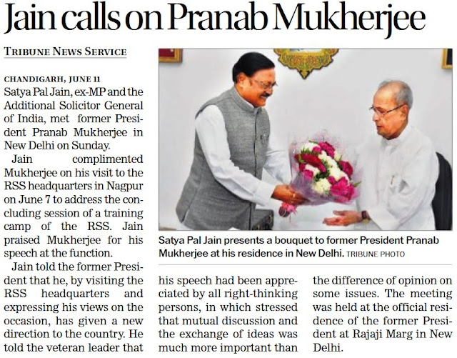 Satya Pal Jain presents a bouquet to former President Pranab Mukherjee at his residence in New Delhi