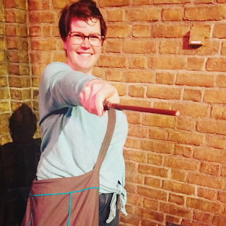 Woman holding a wand at Warner Bros studio tour The Making of Harry Potter