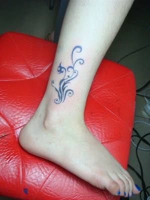 bow tattoo on ankle. foot tattoos designs