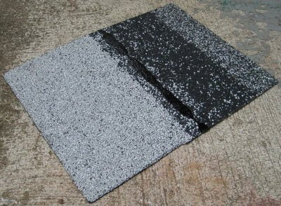 A scrap of asphalt shingle