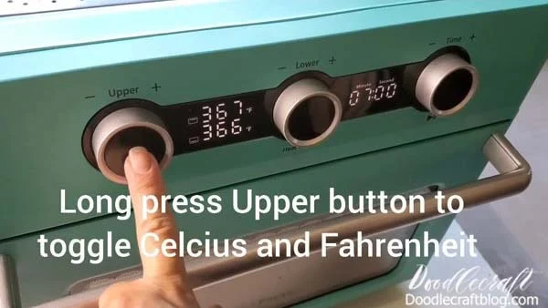 Long pressing the "upper" button will toggle between Fahrenheit and Celsius.