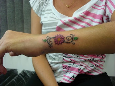 Daisy Tattoo: This design symbolizes innocence. Daisy Tattoos