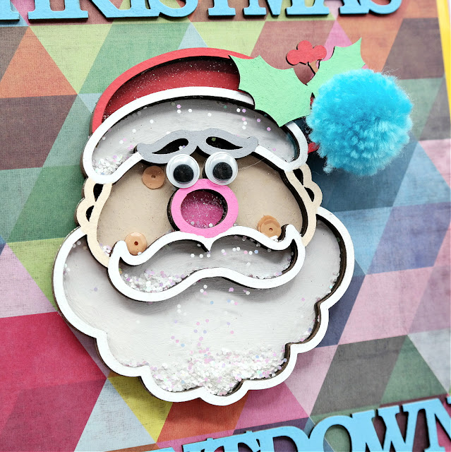 Chipboard Santa Head Shaker Filled with Sequins and Glitter on an Advent Calendar Countdown to Christmas Box