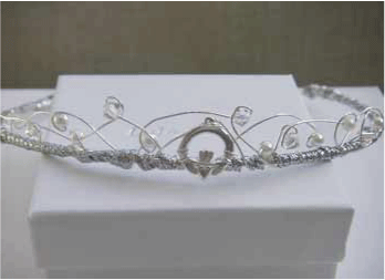 http://www.firstholycommunionday.co.uk/irish-claddagh-first-communion-tiara---handmade-designer-silver-and-pearls-headpiece-2031-p.asp