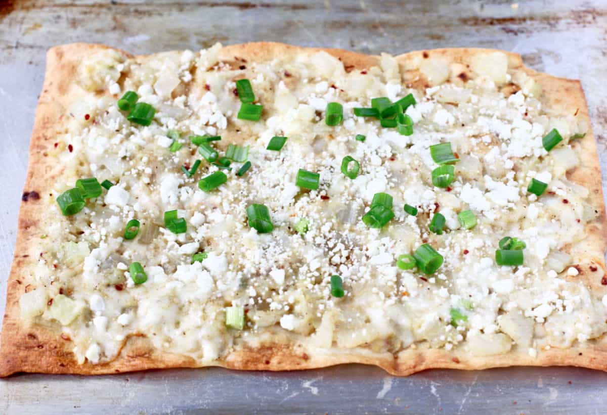 Lavash Pizza with Cauliflower, Fennel, and Mozzarella on a baking sheet.