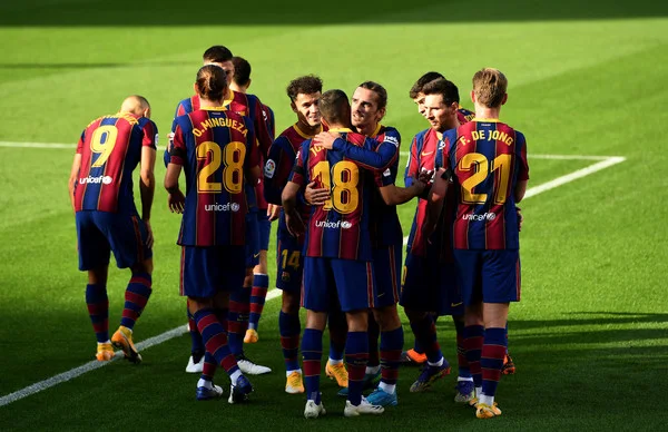 Antoine Griezmann of Barcelona celebrates with team mates after scoring their sides second goal during the La Liga Santander match between FC Barcelona and C.A. Osasuna at Camp Nou on November 29, 2020 in Barcelona, Spain