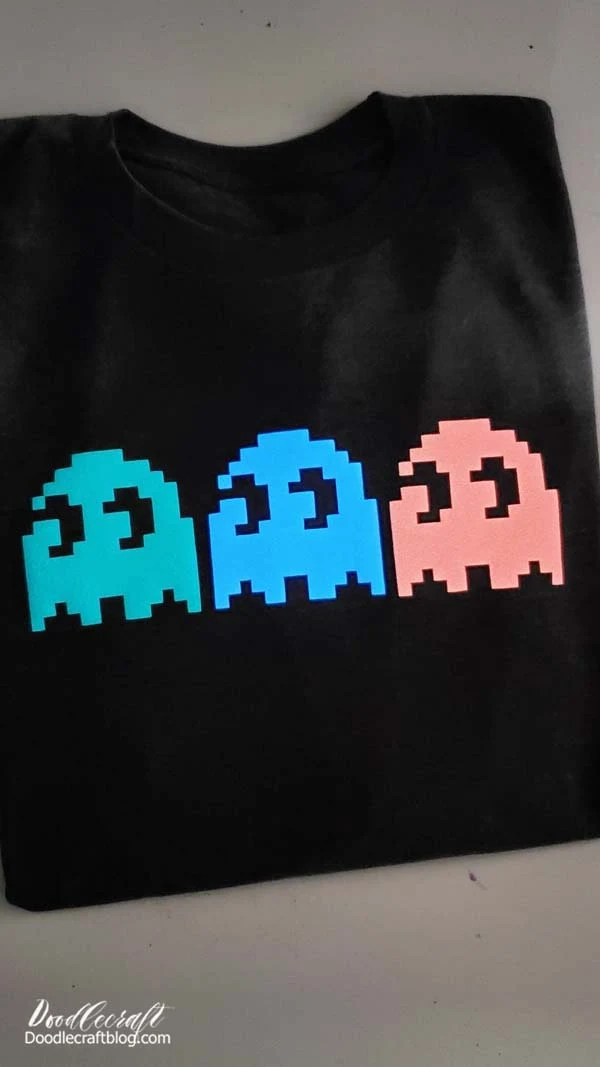 Pac-Man Ghosts Shirt with Glow in Dark Puff Vinyl!  Pac-Man ghosts shirt!? Yesss!!!   Does it get better than that? Yesss!!!   Glow-in-the-dark...and Puff Heat Transfer Vinyl!   Learn how to make the perfect Pac-Man Ghost shirt, for comic conventions, the geek in your life or just for a fun shirt to wear during the Autumn time.   This shirt checks all the boxes.