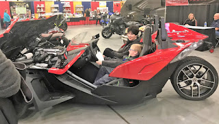 Noah sitting in Polaris Slingshot