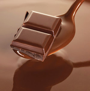 Chocolate squares on spoon