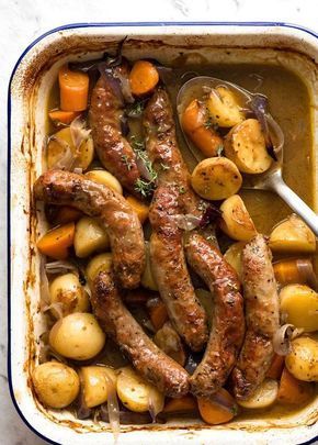 Cooking sausages in the oven with vegetables and gravy is a terrific quick dinner idea that takes mere minutes to assemble! The sausages get nicely browned, the vegetables tender, and a flavour packed gravy. Kind of like making a stew