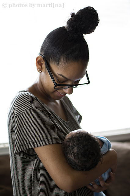 Mother holding her newborn baby boy, photo by Martina