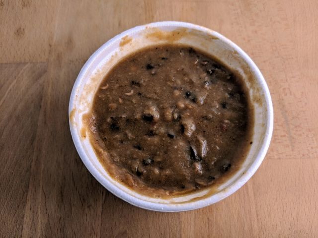 Popeyes Black Eyed Peas in a container.