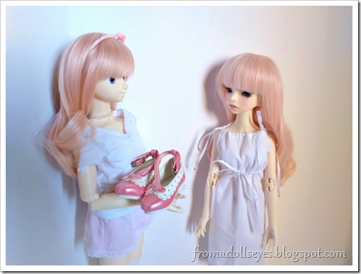 Another doll presents shoes to the shoeless ball jointed doll.