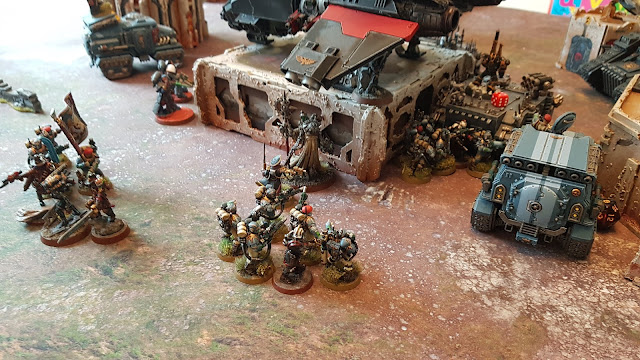 Warhammer 40k battle report - 2000 points - Primaris Vanguard, Militarum Tempestus, Grey Knights and Assassins vs Black Legion and Nurgle Daemons.