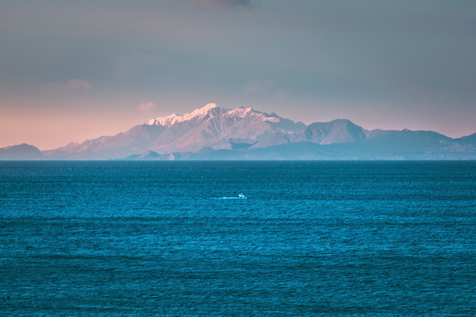 Kaikoura mountain, fishing boat and Cook Strait