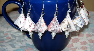 multiple pairs of German bell ornaments hanging on mug