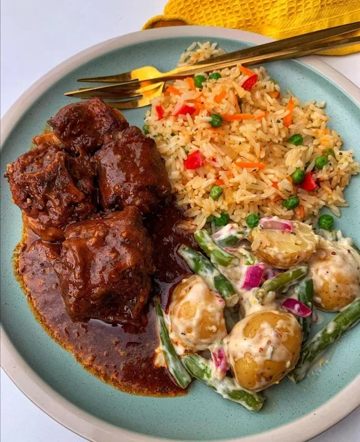 A Perfectly Balanced Meal: Braised Beef Stew, Vegetable Fried Rice, and Creamy Potato Salad
