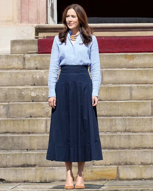 Queen Mary wore a sky blue silk shirt and a navy blue midi skirt during ceremony in the Chancellery House at Fredensborg Castle