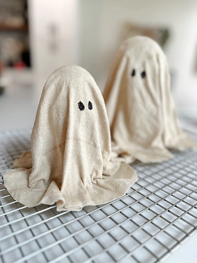 fabric ghosts with eyes on drying rack