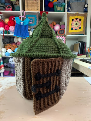 picture of the hut sitting on a desk shown from the front.