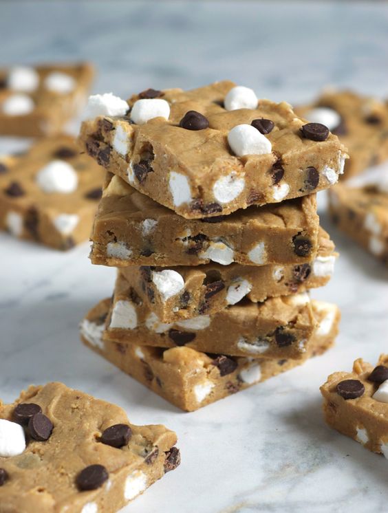 These easy no-bake s’mores are like a cross between cookie dough, fudge, and everyone’s favorite campfire dessert! I’m usually like the last person on the planet to get excited about a no-bake…