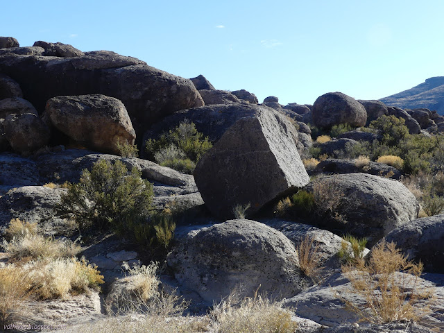57: boulder with line and figure
