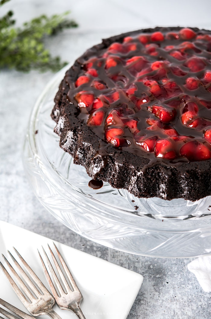 Black forest cake on clear glass cake stand