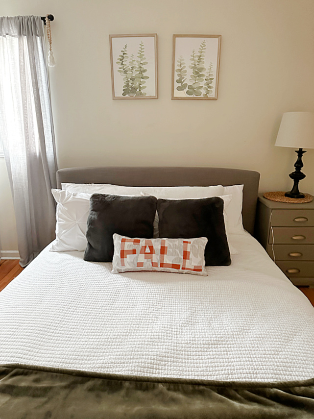 bedroom with fall pillow on bed