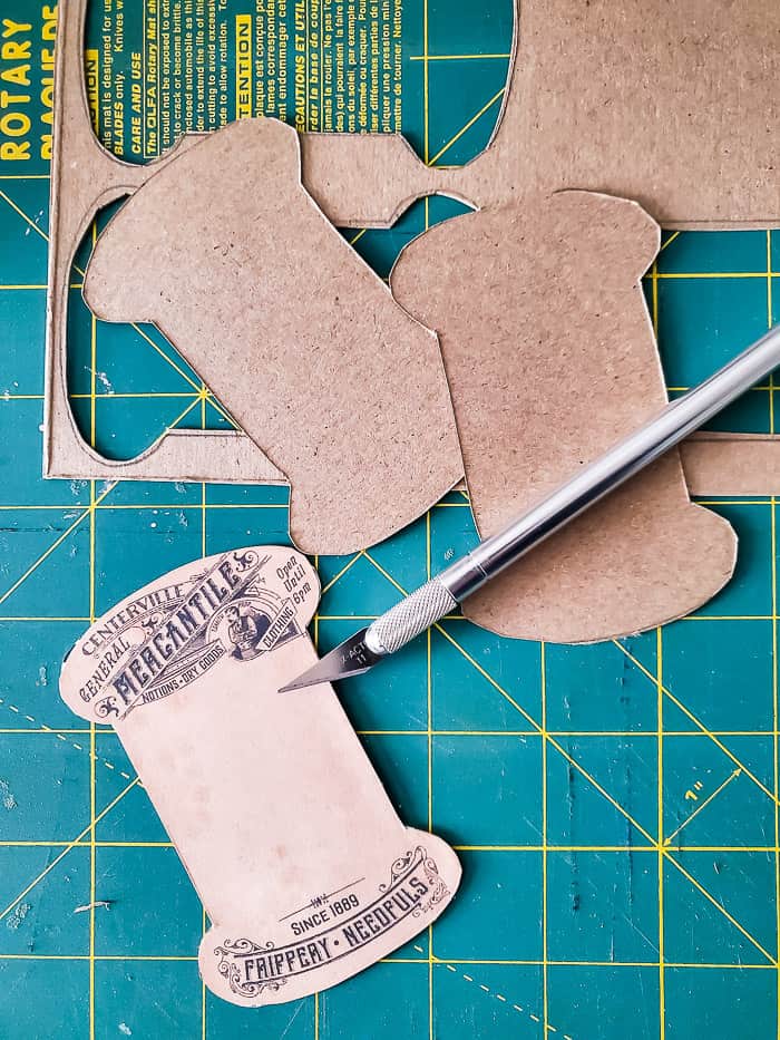 cut cardboard spool shapes