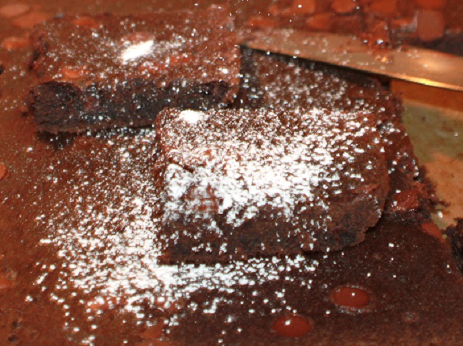 this is a chocolate spice bar made with pumpkin puree sprinkled with powdered sugar