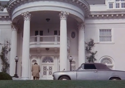 Columbo's 1959 Peugeot 403 in front of a suspect's mansion.