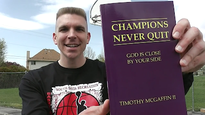 Tim McGaffin holding his book, "Champions Never Quit: God Is Close By Your Side" 