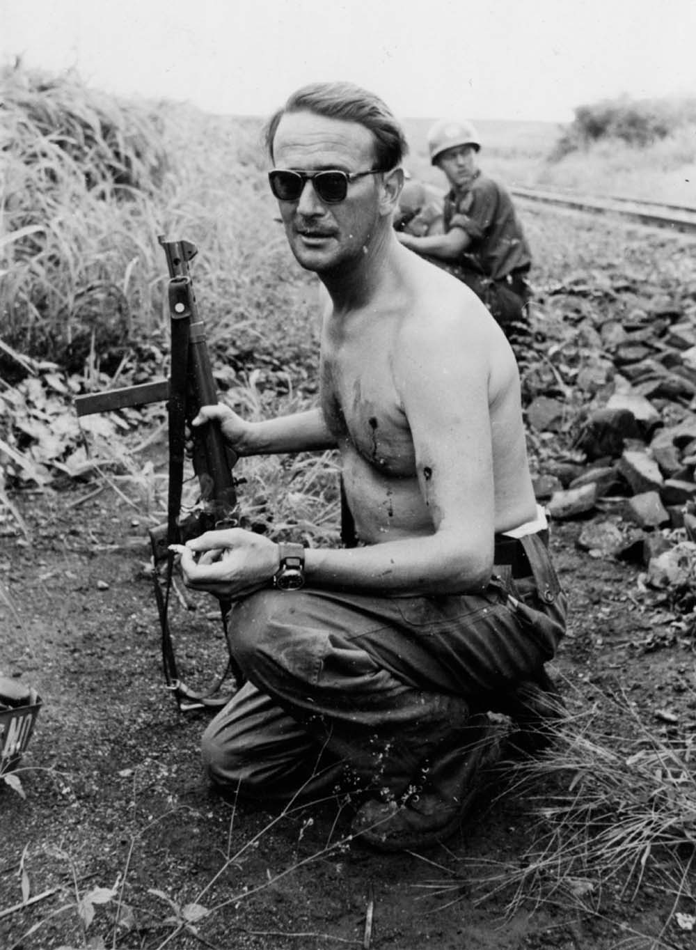 Swedish Major Erik Bonde smokes a cigarette after being ambushed and shot twice. Congo, Jan 15th 1961.