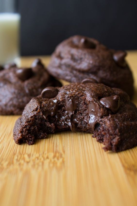 Rich, fudgy, soft batch double chocolate chip cookies oozing with chocolate chips - Chocolate lovers rejoice!