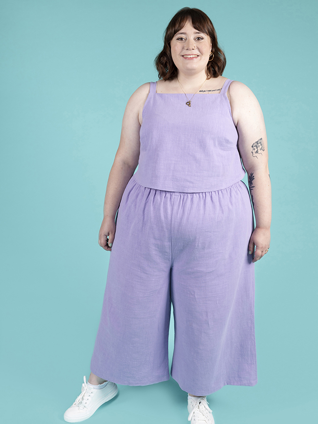 Plus size model wearing matching top and trouser co-ord in a pastel lilac. The set was made using the Esti co-ord sewing pattern