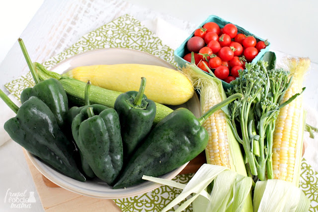 Put all of those fresh garden & farmers market veggies to tasty use with this recipe for Summer Veggie Stuffed Poblano Peppers.