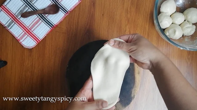 Butter naan dough resting during the second proofing after being shaped into crack-free bowls.