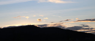 Sun backlighting the ridge; it's sliding further west all the time