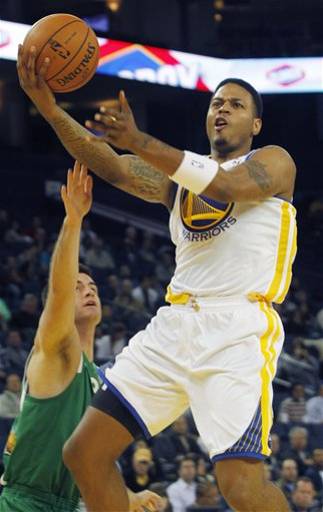 golden state warriors brandon rush goes up to shoot past