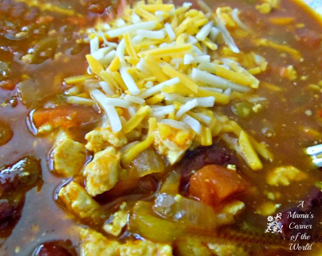 Meatless Monday Bowl of Vegetable Chili with tomatoes, onions, veggies and shredded cheese