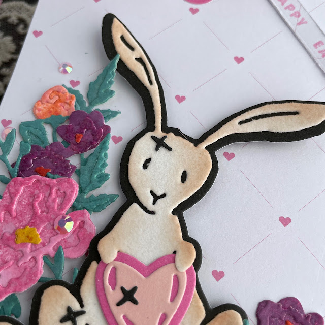 Velveteen Rabbit Easter Bunny tag created with: Tim Holtz bunny stitch, brushstroke flowers mini die, distress spray stain, oxide spray, mica stain, distress ink; Doodlebug velvet cardstock; Scrapbook.com nested tags, butterflies die, sherbet pattern paper, smooth cardstock; Pinkfresh jewels