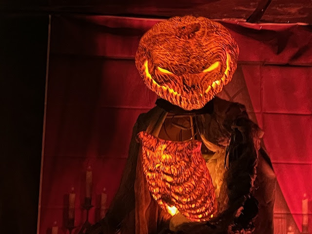 a pumpkin head with a glowing face