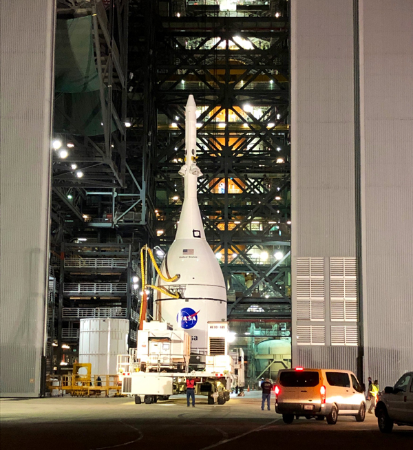 With the Space Launch System rocket visible behind it, the Orion Artemis 1 capsule is about to enter the Vehicle Assembly Building at NASA's Kennedy Space Center in Florida...on October 19, 2021.