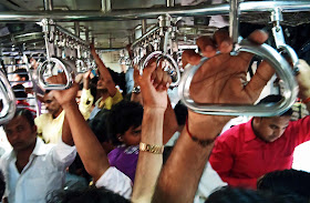 men's compartment in crowded local