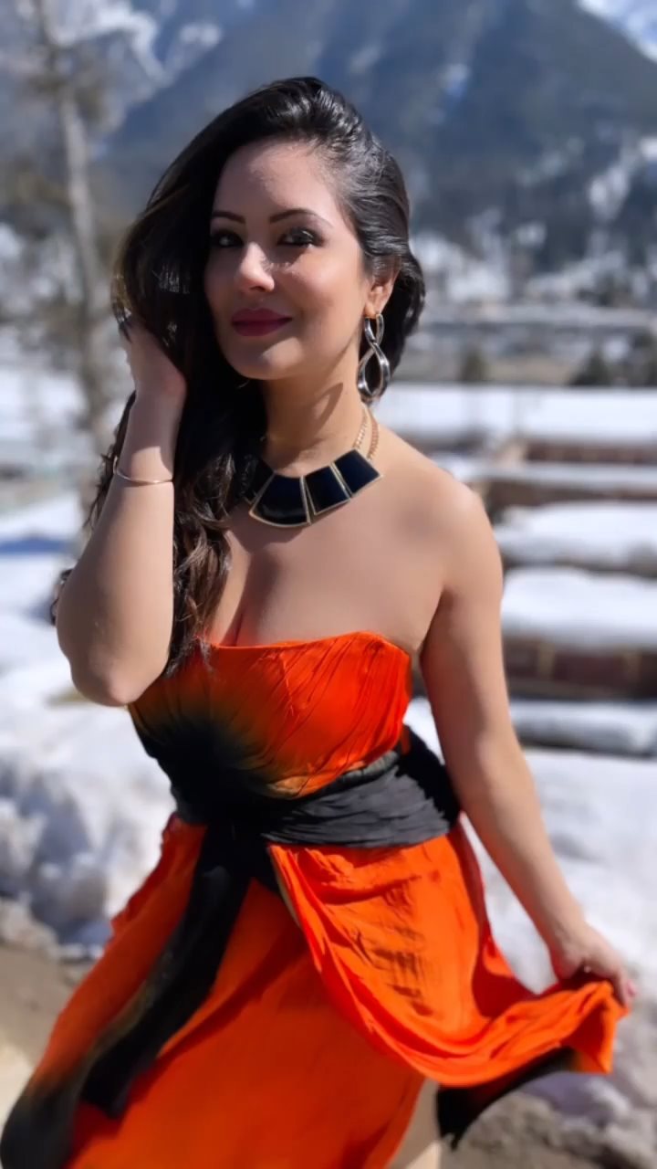Puja Banerjee cleavage orange dress