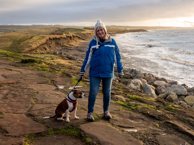 Photo of me walking Ruby on the coastal path above Grasslot shore at Maryport