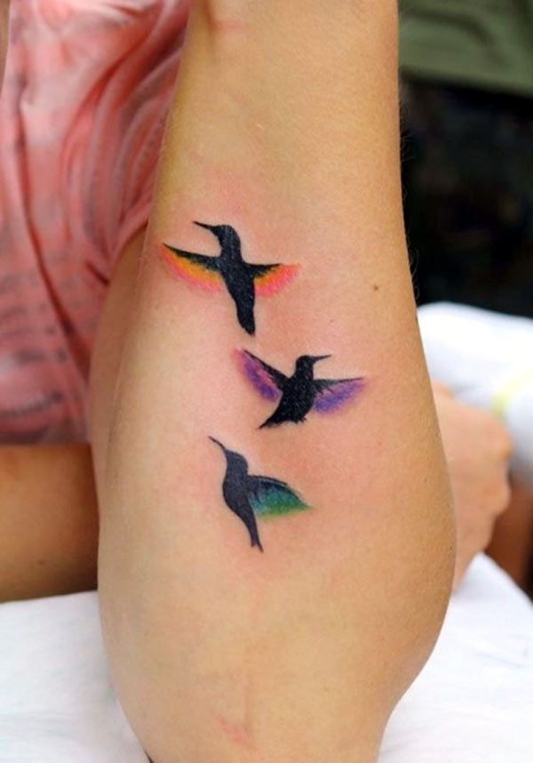 So cute and lovely birds with beautiful feathers greatest tattoo designs for girl on the forearm.