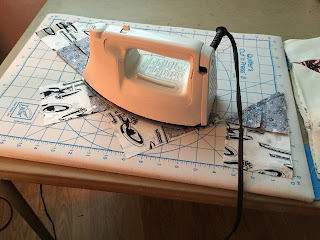Ironing, a most important part of quilting.