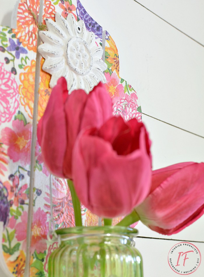 An easy Dollar Store Craft idea with Decoupage Napkins. This DIY Wall Sconce is a budget-friendly Spring or Summer decor idea that can be used as a mason jar candle holder lantern or hanging flower vase.